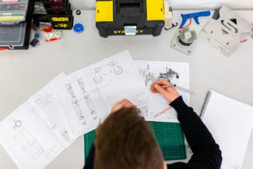 Quality engineer measuring a pet product component with precision tools during an AQL inspection