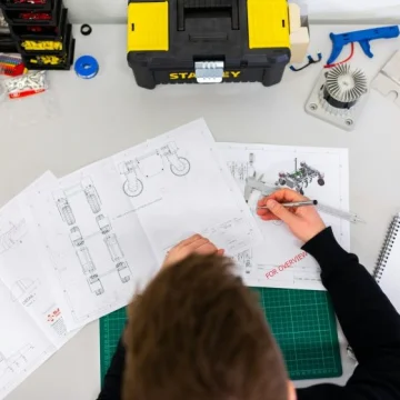 Quality engineer measuring a product component with precision tools